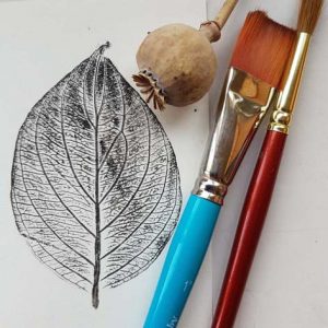 Leaf print, paint brushes ad poppy seed head